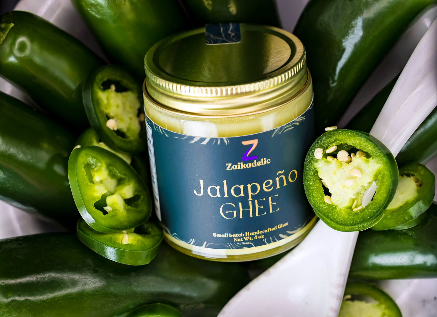 Zaikadelic jalapeño ghee in a bowl of chilis