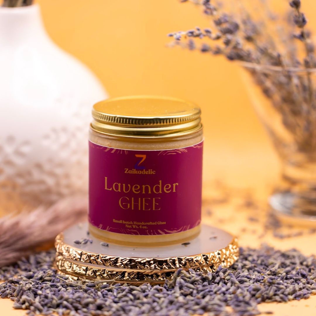 A jar of lavender ghee with lavender buds